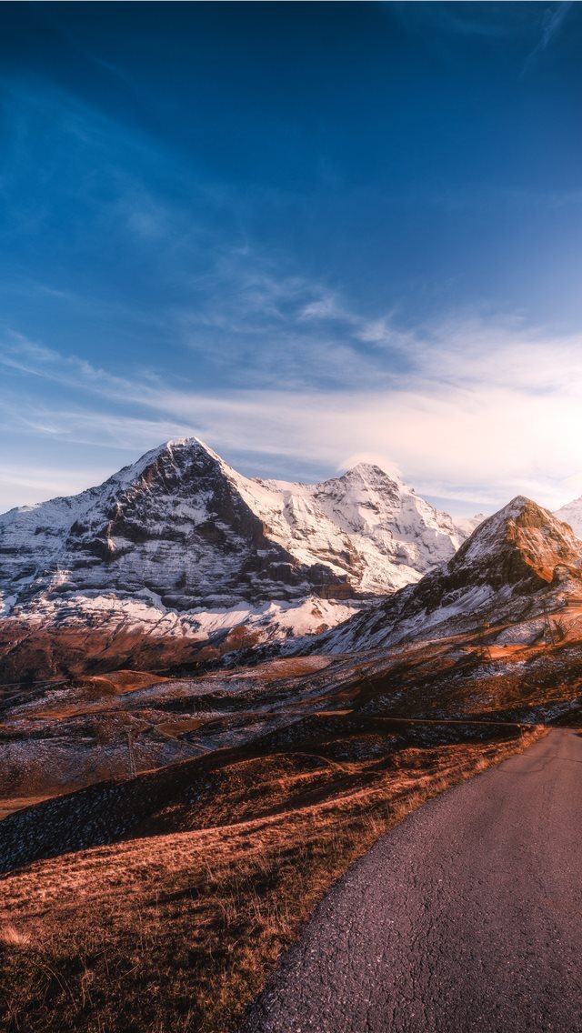 640x1136 roadway beside iced capped mountain during daytime - switzerland iPhone Wallpaper