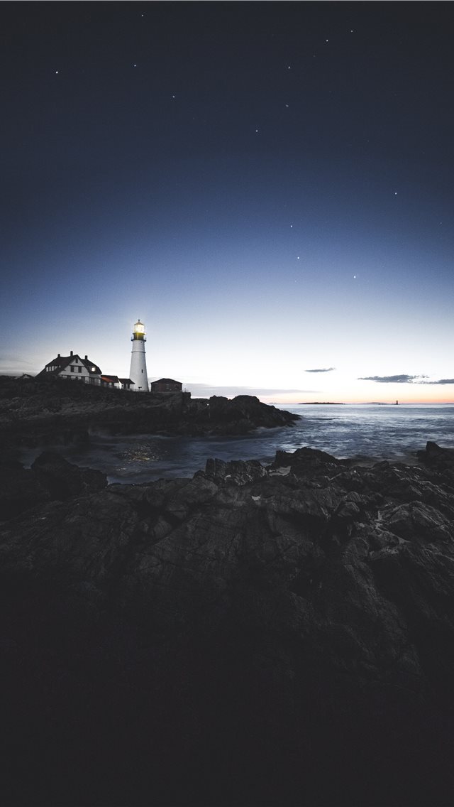 640x1136 lighthouse beside house near the edge of stone isl... - night sky iPhone Wallpaper