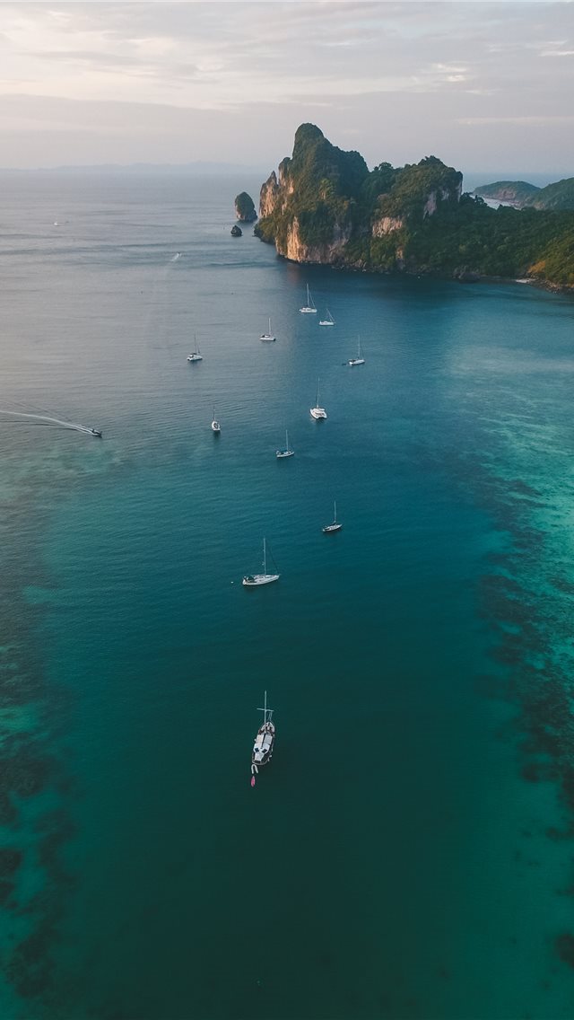 640x1136 white boats on ocean water under gray sky - phi phi islands iPhone Wallpaper