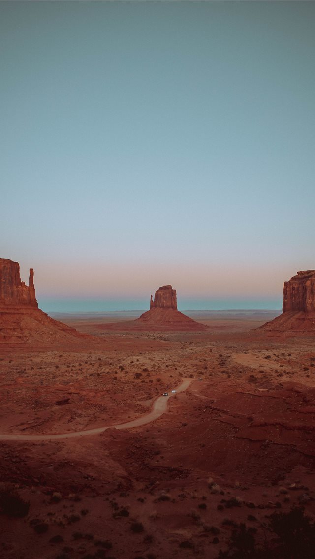 640x1136 brown rocky mountains and field during day - monument valley iPhone Wallpaper