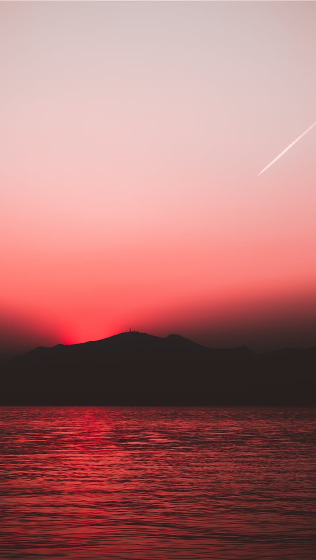 silhouette photography of body of water iPhone wallpaper 