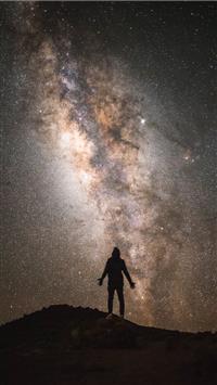 silhouette of a man with the Milky Way background wallpaper