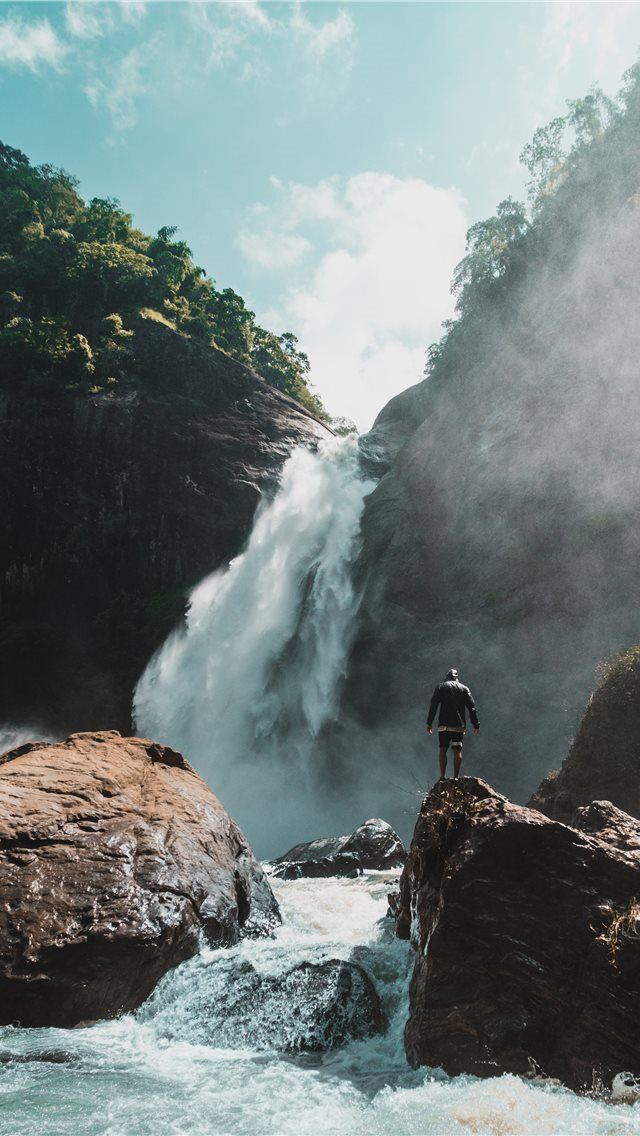 640x1136 man standing stone with waterfalls - sri lanka iPhone Wallpaper