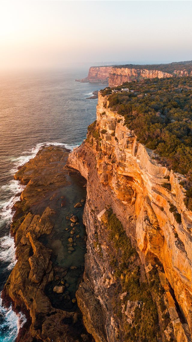 640x1136 aerial photography of mountain beside sea - fire iPhone Wallpaper