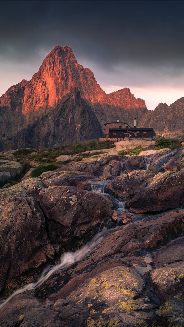 640x1136 black building in front of mountain during golden ... - mountain iPhone Wallpaper