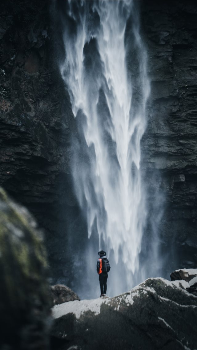 640x1136 man standing near waterfalls -  iPhone Wallpaper