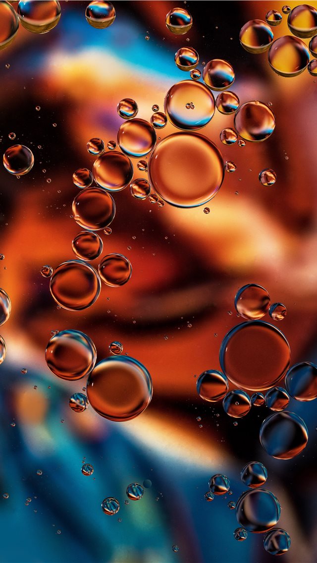  Copper Glow Oil drops on water The background is ... iPhone wallpaper 