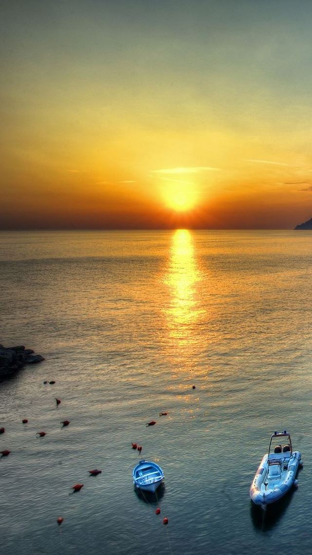 640x1136 Sunset at sea - boat iPhone Wallpaper