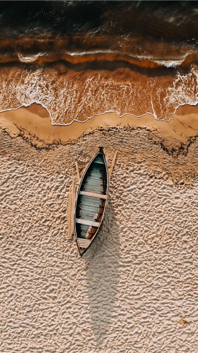 640x1136 brown and white boat on brown sand -  iPhone Wallpaper
