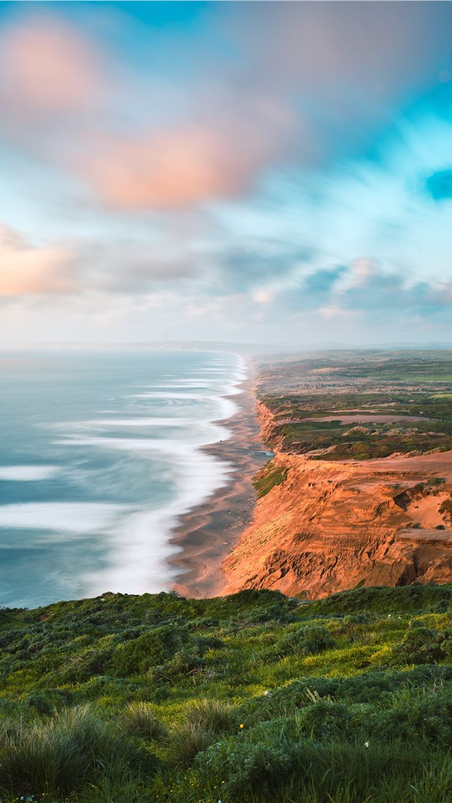 640x1136 brown and green mountain beside body of water duri... - nature iPhone Wallpaper