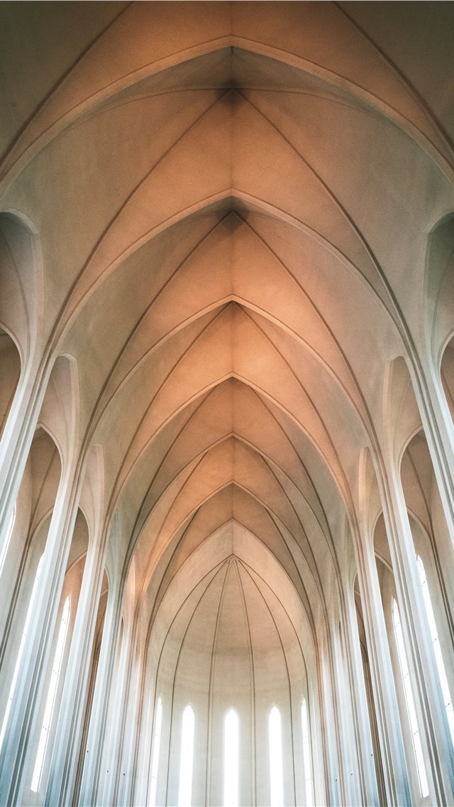 640x1136 low angle photography of concrete building - iceland iPhone Wallpaper