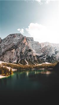 lake near mountain under blue sky during daytime wallpaper