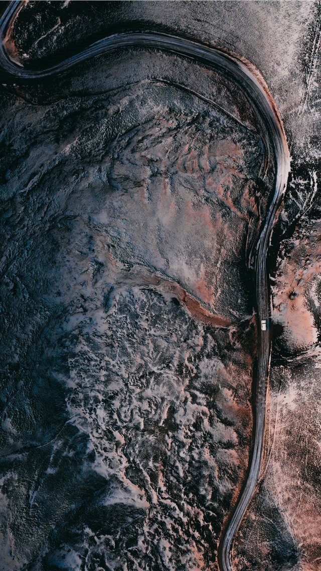 640x1136 aerial view of road in the middle of snow covered ... - iceland iPhone Wallpaper