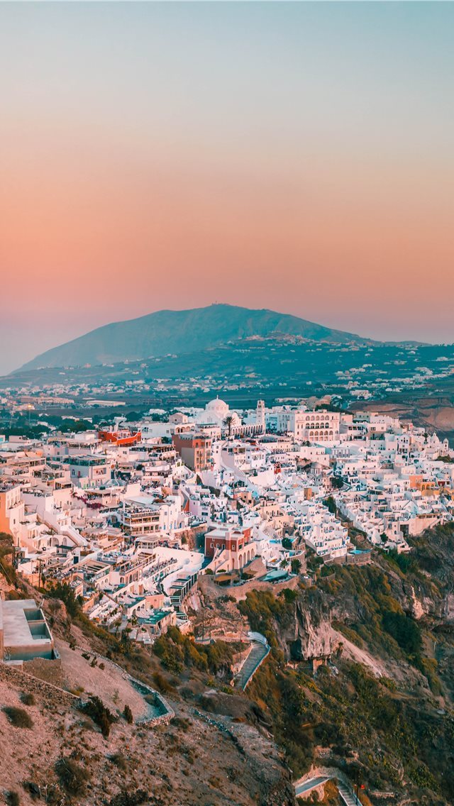 640x1136 city buildings on mountain during daytime - grey iPhone Wallpaper
