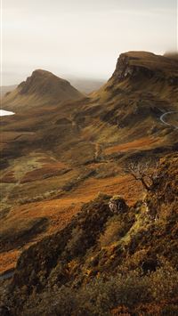 brown and green mountain under white sky during da... wallpaper