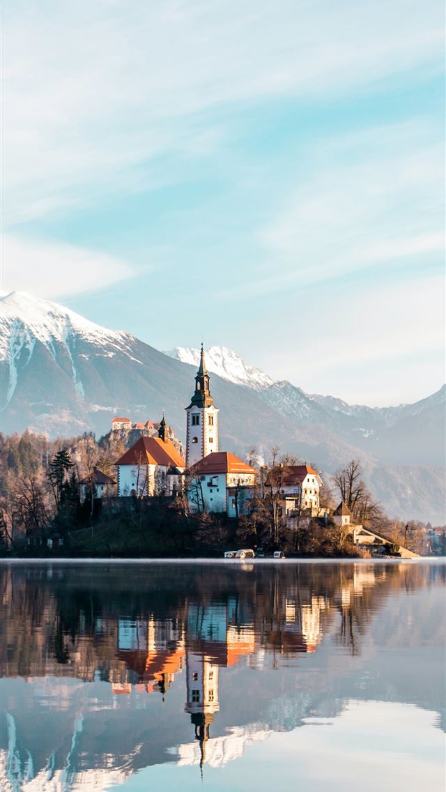 640x1136 brown and white concrete building near body of wat... - slovenia iPhone Wallpaper