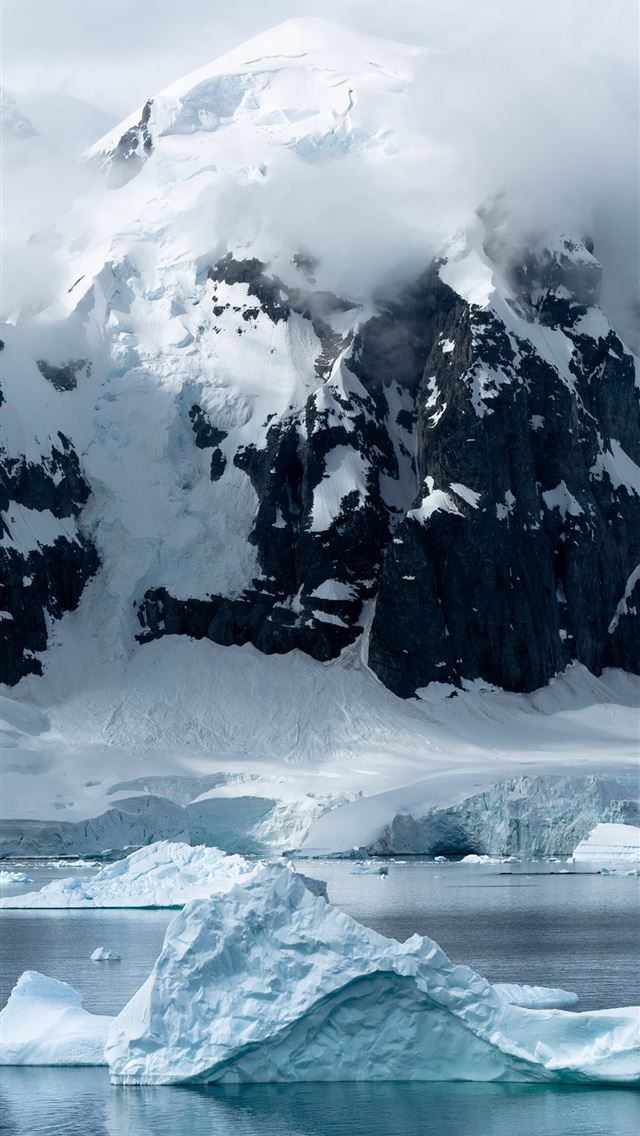 640x1136 small iceberg beside large iceberg - antarctica iPhone Wallpaper