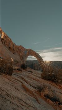 brown rock formation under blue sky during daytime wallpaper