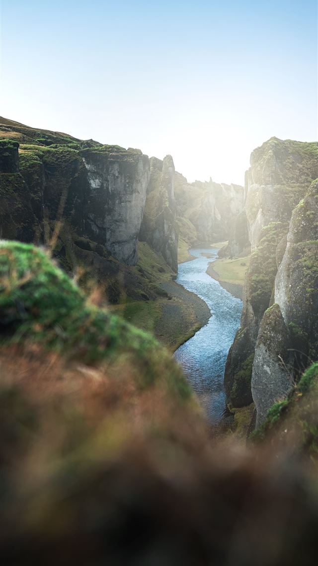 river between green grass covered mountain during ... iPhone wallpaper 