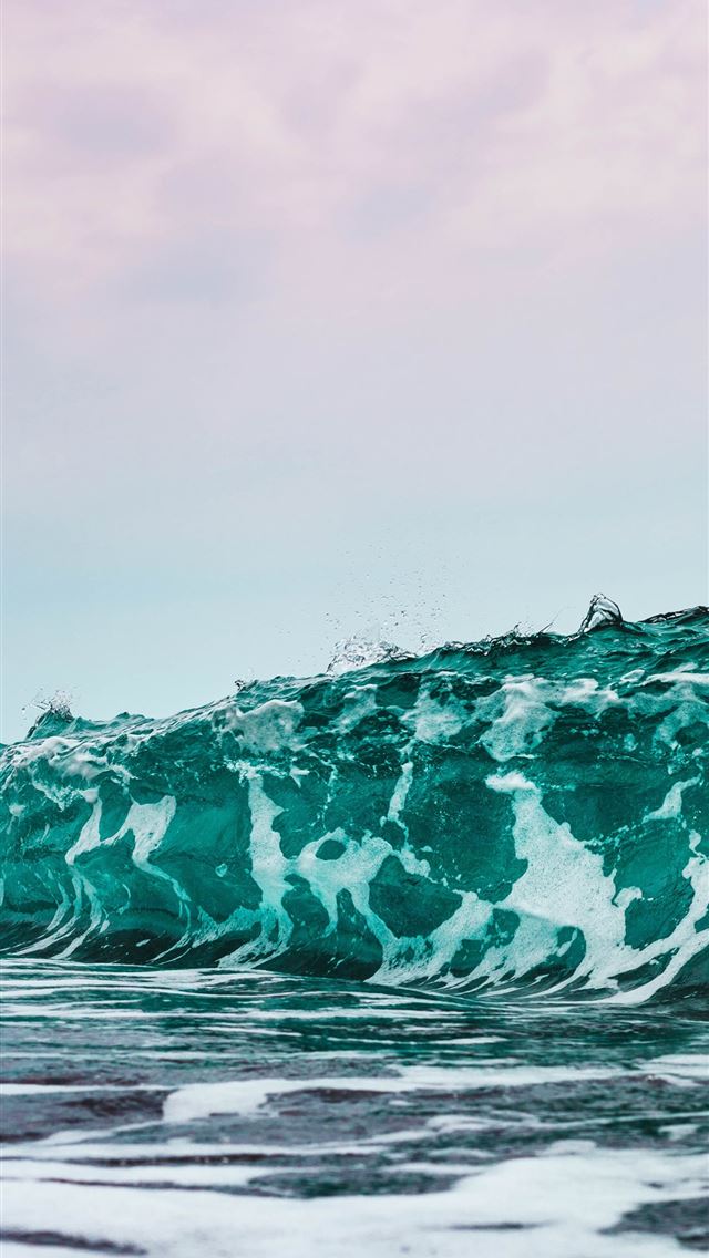 640x1136 person surfing on sea waves during daytime - santorini iPhone Wallpaper