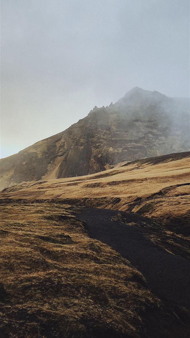 shallow focus photo of brown mountain iPhone wallpaper 