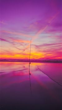 sea waves crashing on shore under golden hour wallpaper