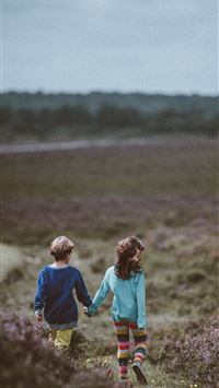 siblings walking holding hands and background wallpaper