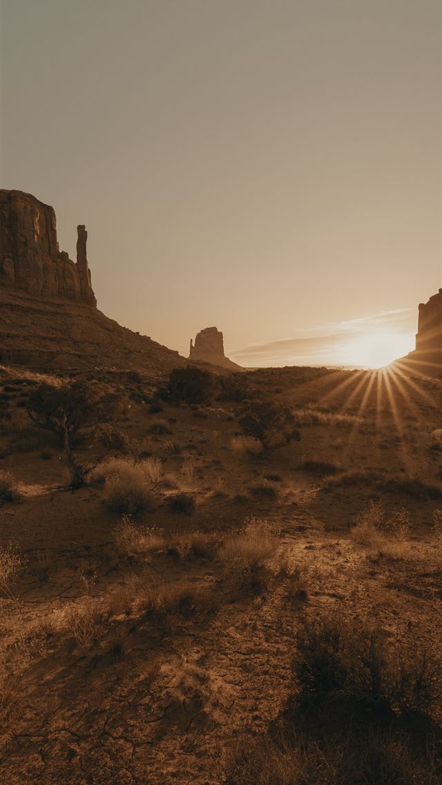 640x1136 brown rock formation under white sky during daytim... - monument valley iPhone Wallpaper