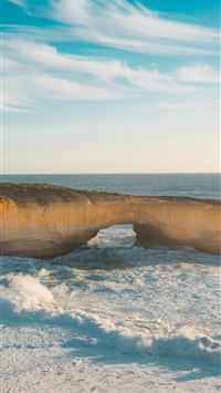 boulders body of water wallpaper