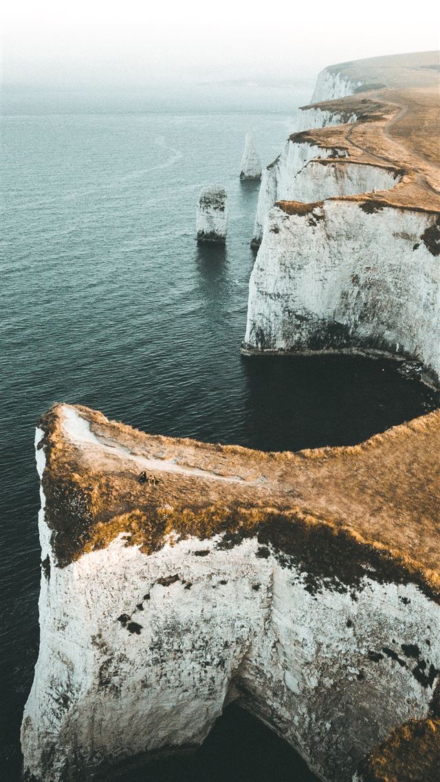 640x1136 aerial view photography of mountain cliff near bod... - travel iPhone Wallpaper