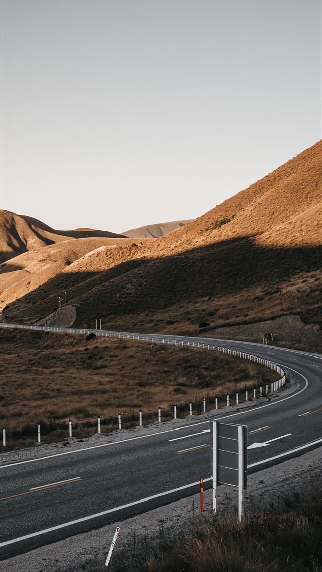 640x1136 gray asphalt road between brown mountains during d... -  iPhone Wallpaper