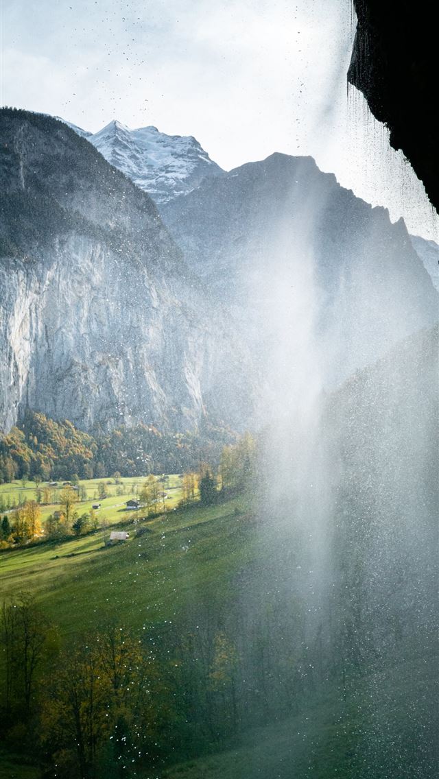 640x1136 green grass field near mountain during daytime - lauterbrunnen iPhone Wallpaper