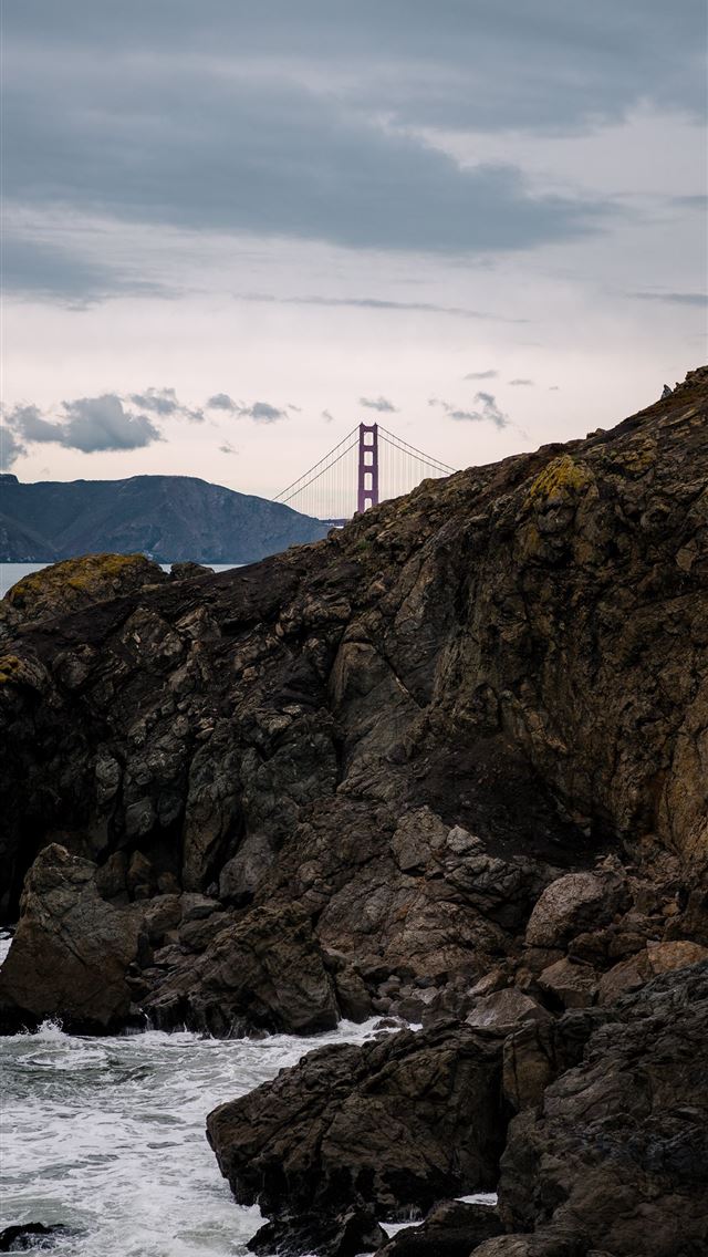 640x1136 brown rock formation near bridge under white cloud... - grey iPhone Wallpaper