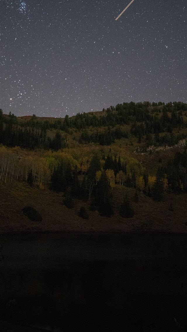 640x1136 shooting star over green mountain during nighttime - space iPhone Wallpaper