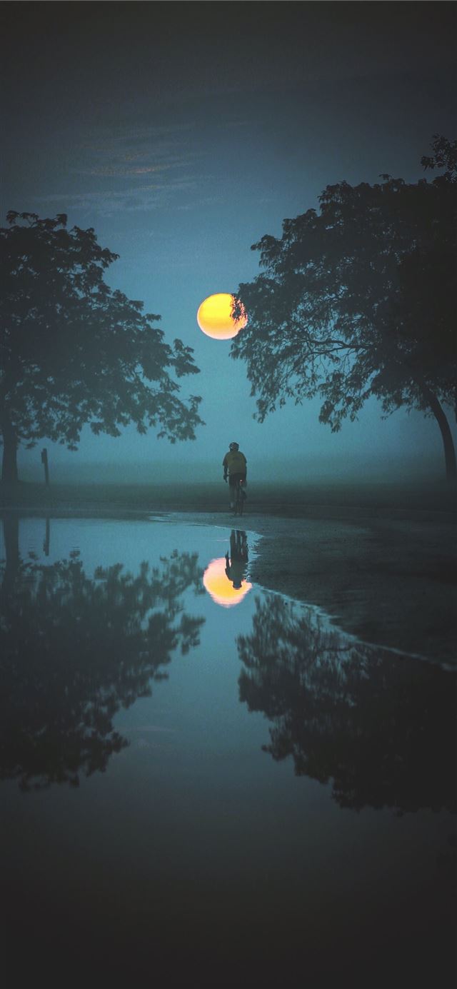 1125x2436 person standing and looking at moon - yellow iPhone X Wallpaper