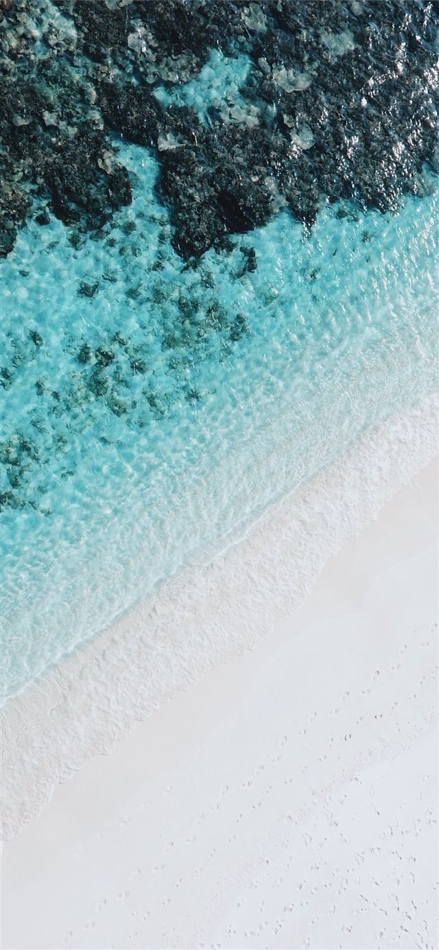 1125x2436 high angle photography of beach side - water iPhone X Wallpaper