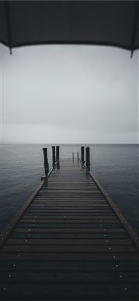 brown wooden dock near body of water at daytime wallpaper
