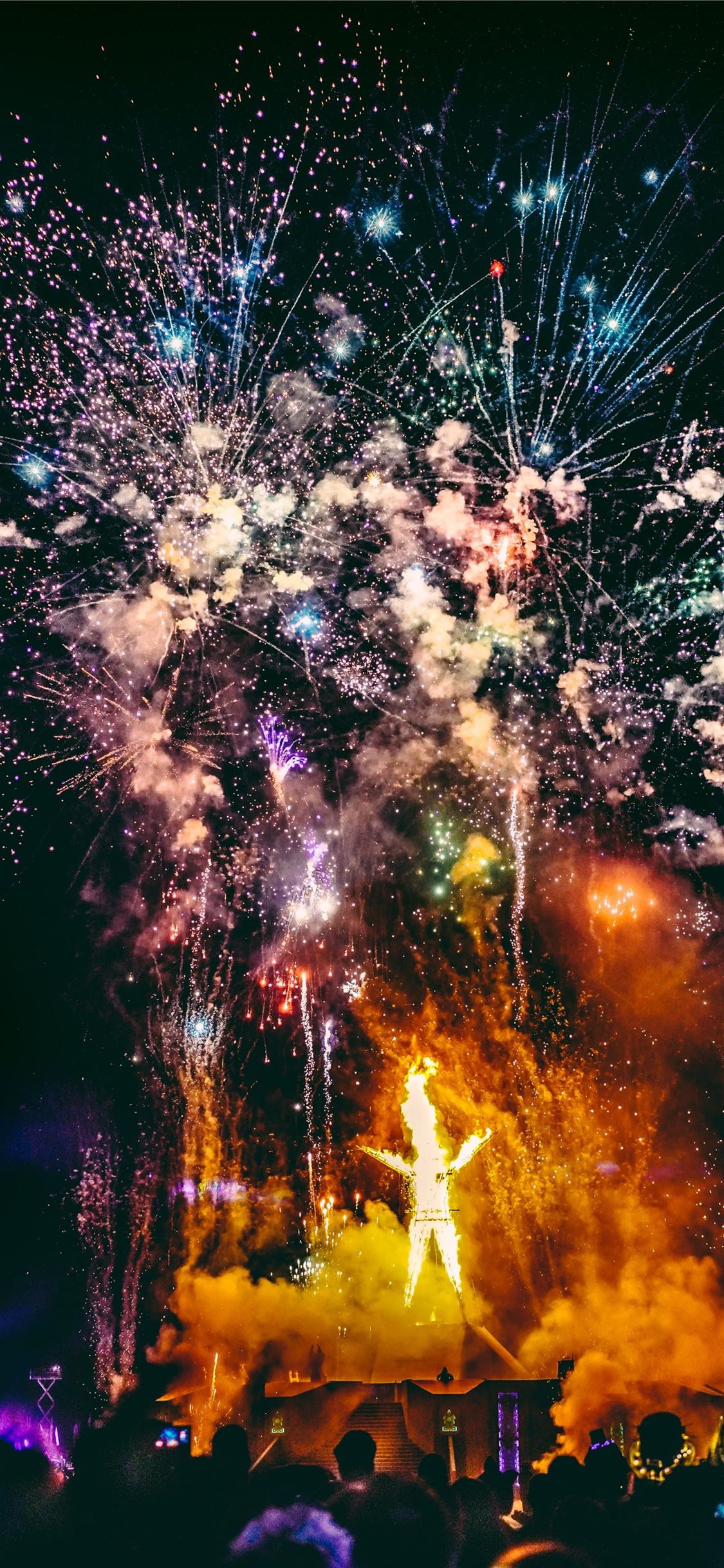 crowd of people watching fireworks display iPhone X wallpaper 