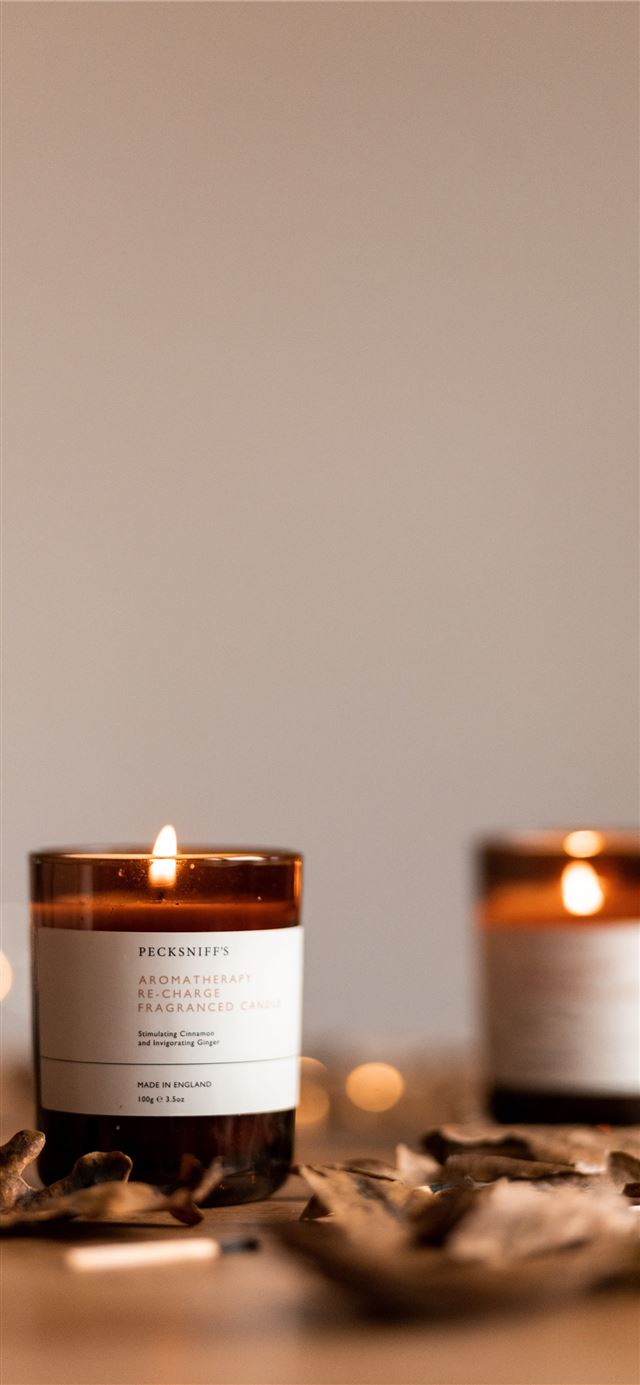 1125x2436 two amber glass containers - fall iPhone X Wallpaper