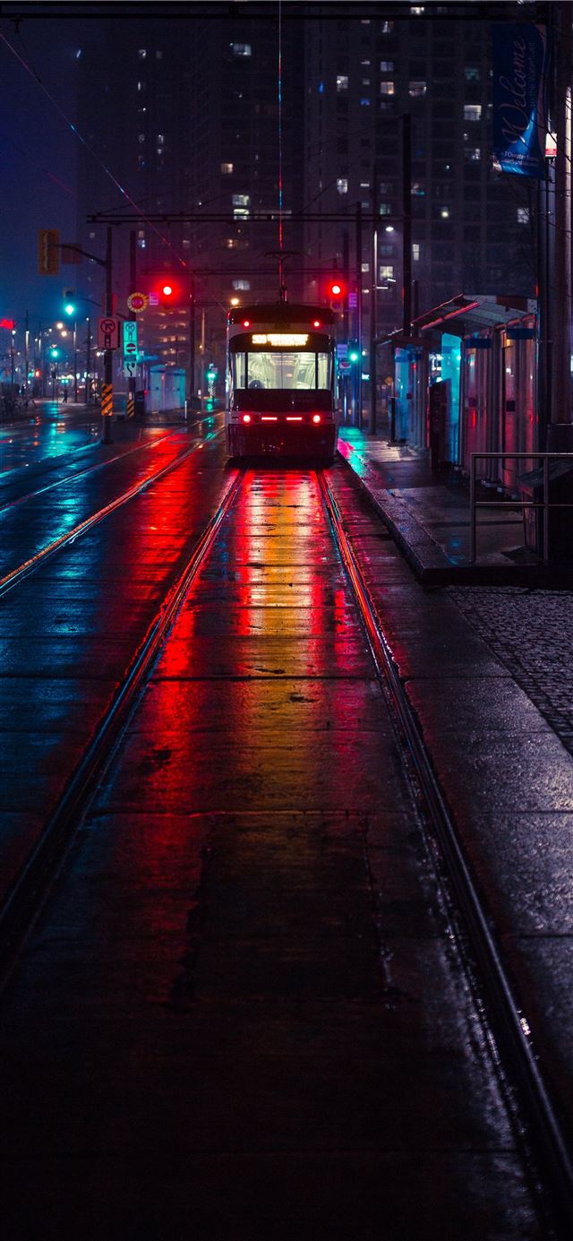 1125x2436 photo of tram beside waiting station during nightt... - canada iPhone X Wallpaper