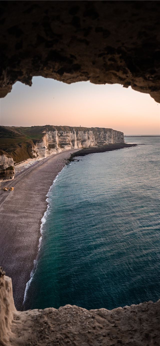1125x2436 cave viewing of cliff during daytime -  iPhone X Wallpaper