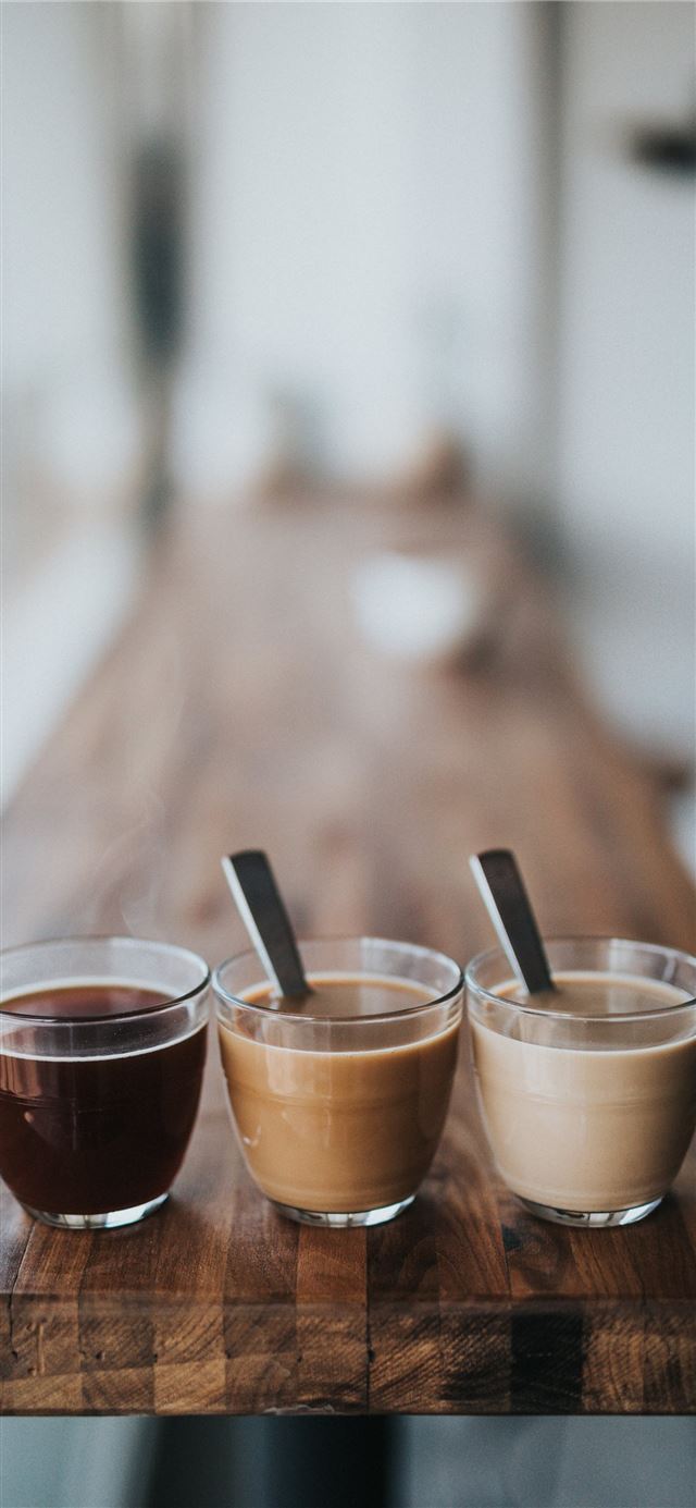 1125x2436 macro photography of three assorted liquids - coffee iPhone X Wallpaper