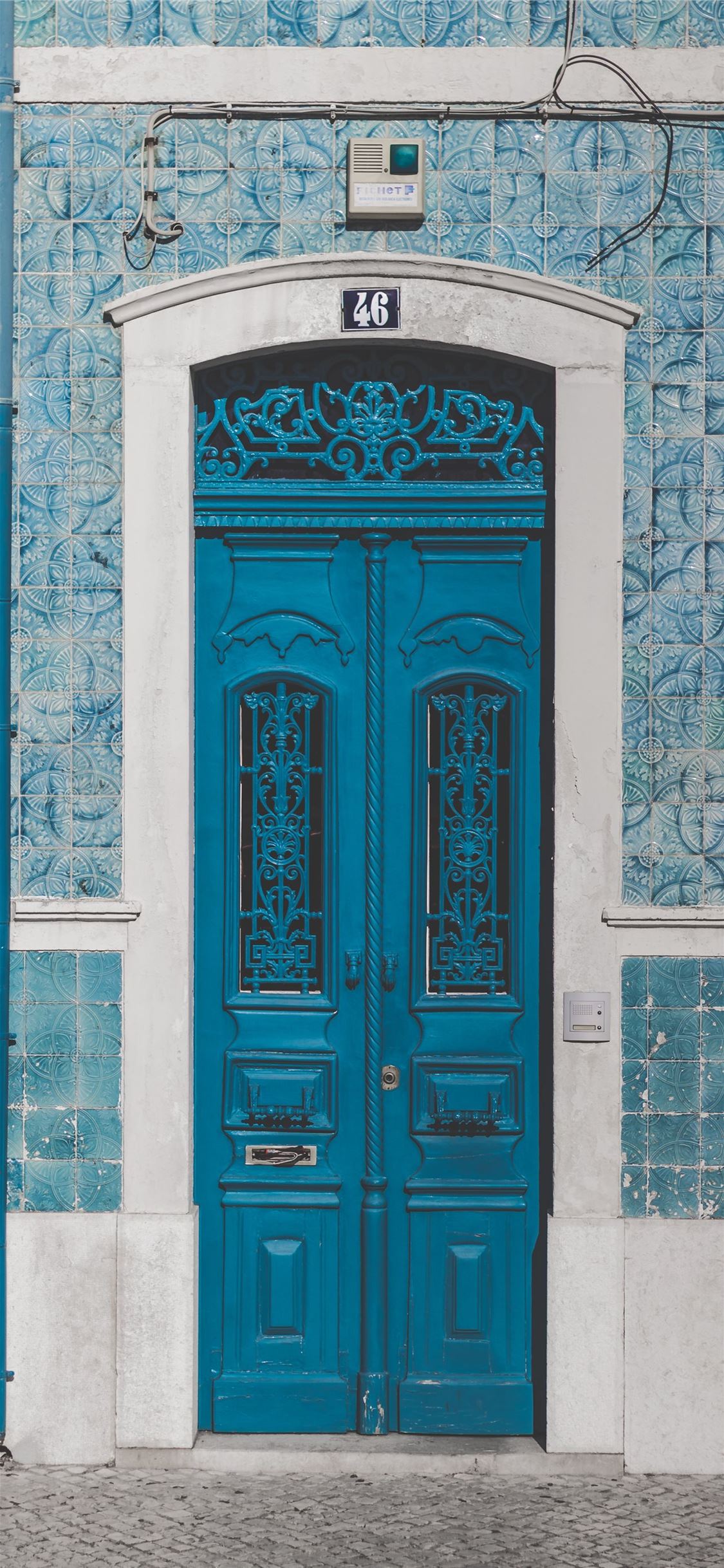 blue wooden door closed with 46 sign iPhone X wallpaper 