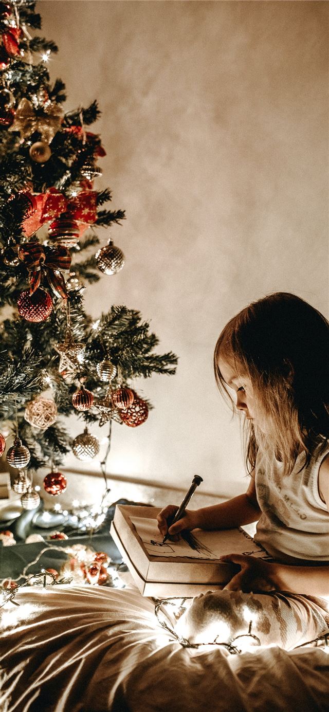 1125x2436 girl writing on bed -  iPhone X Wallpaper