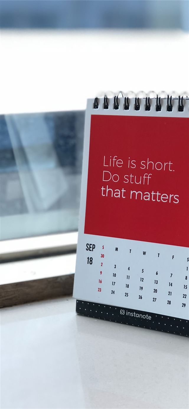 1125x2436 spiral freestanding calendar on white surface - india iPhone X Wallpaper