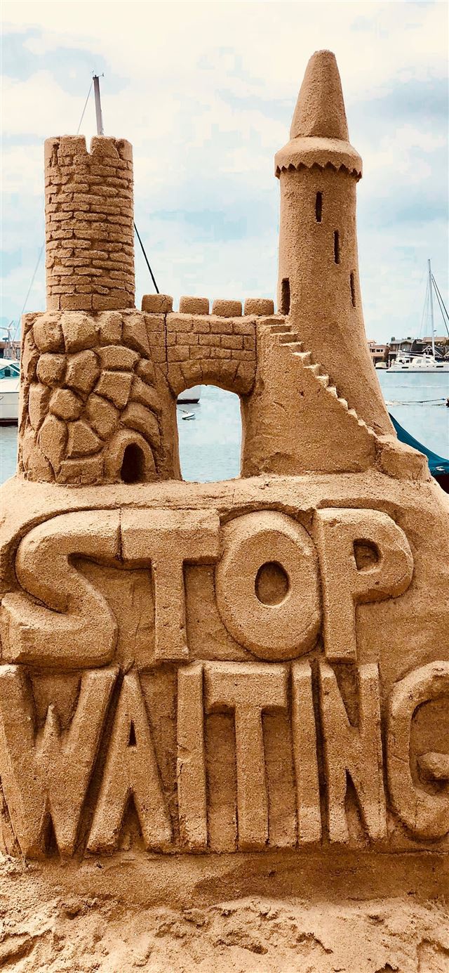 1125x2436 sand castle beside body of water -  iPhone X Wallpaper