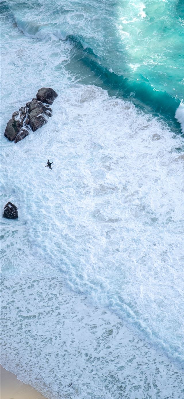 1125x2436 brown rocks on white sand beach 5k - rocks iPhone X Wallpaper