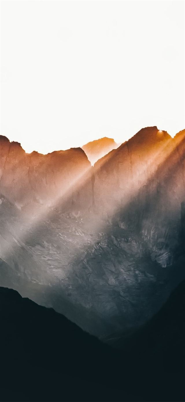 1125x2436 sun beams over mountains - mountains iPhone X Wallpaper