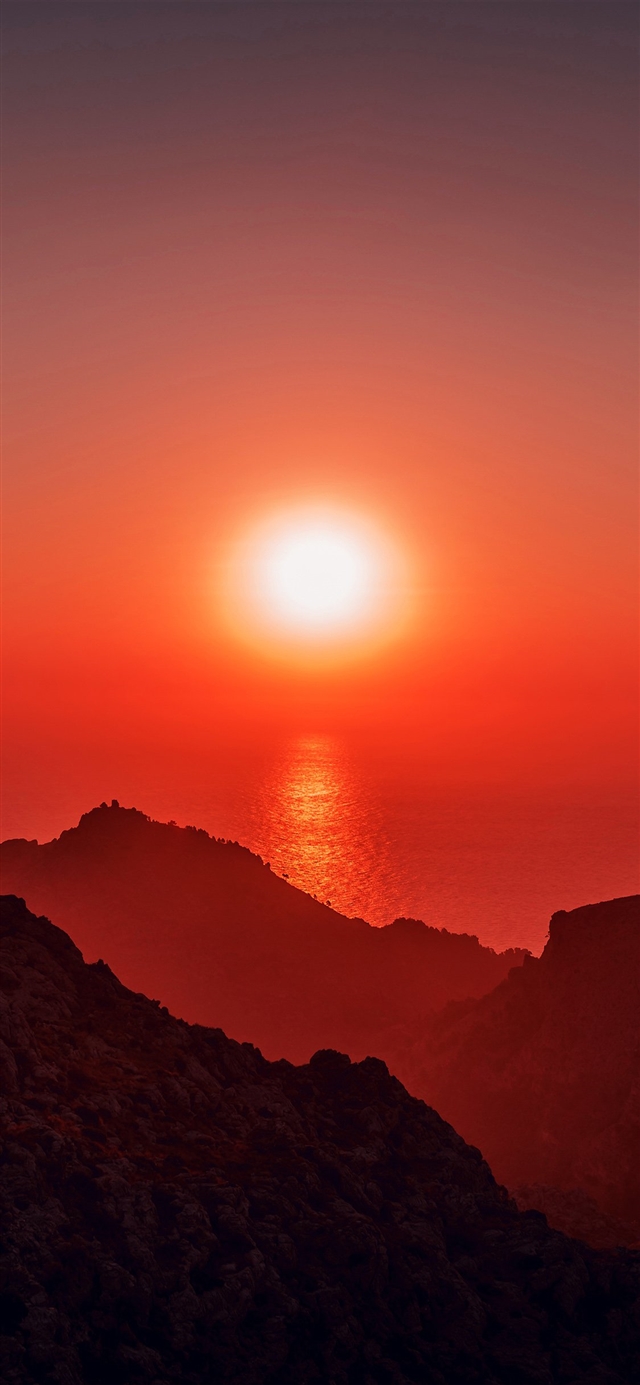 1125x2436 Sea sunset afternoon rock mountain - yellow iPhone X Wallpaper