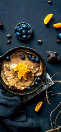 Pancakes with orange and blueberries wallpaper
